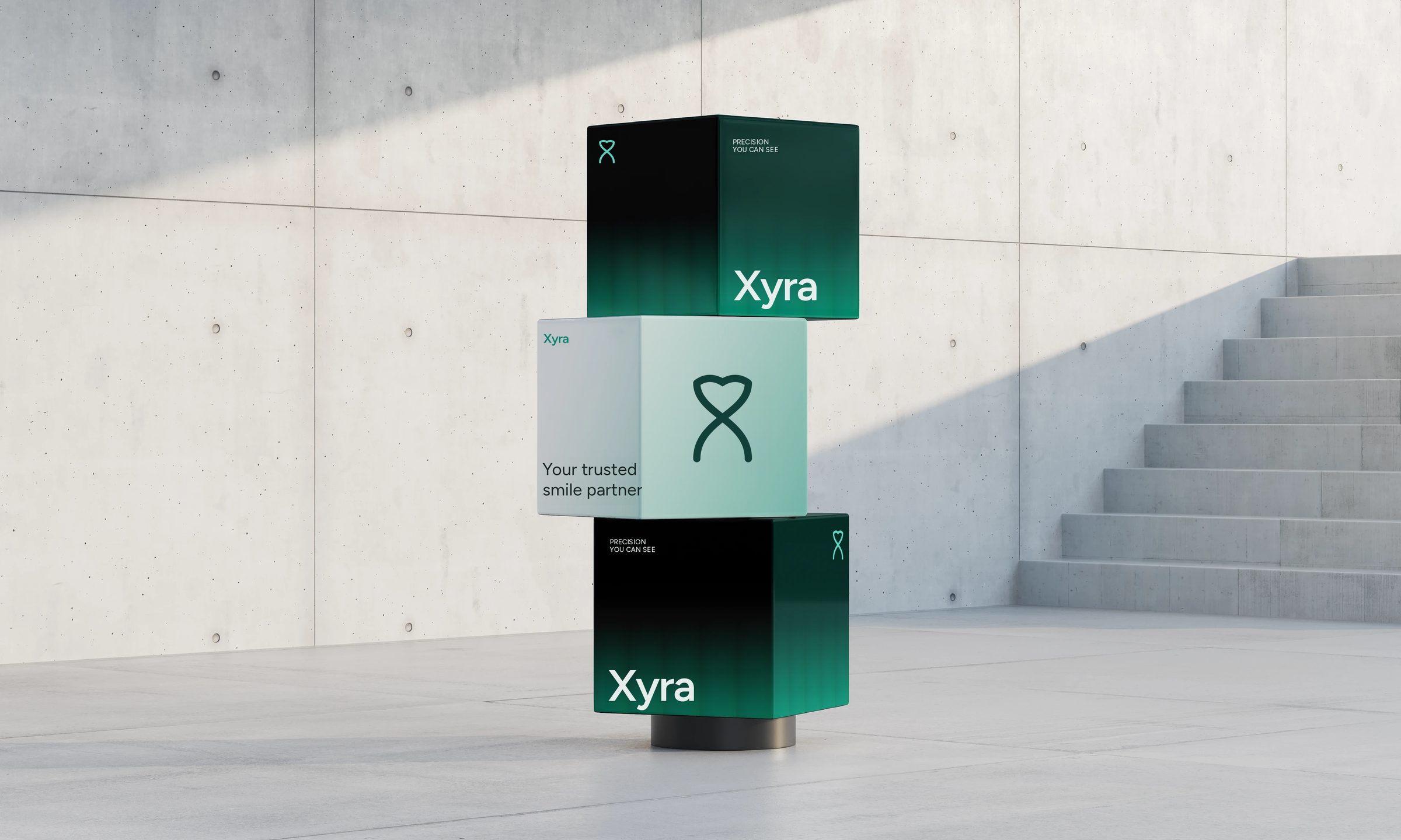 Stack of three Xyra branded cubes in a concrete room